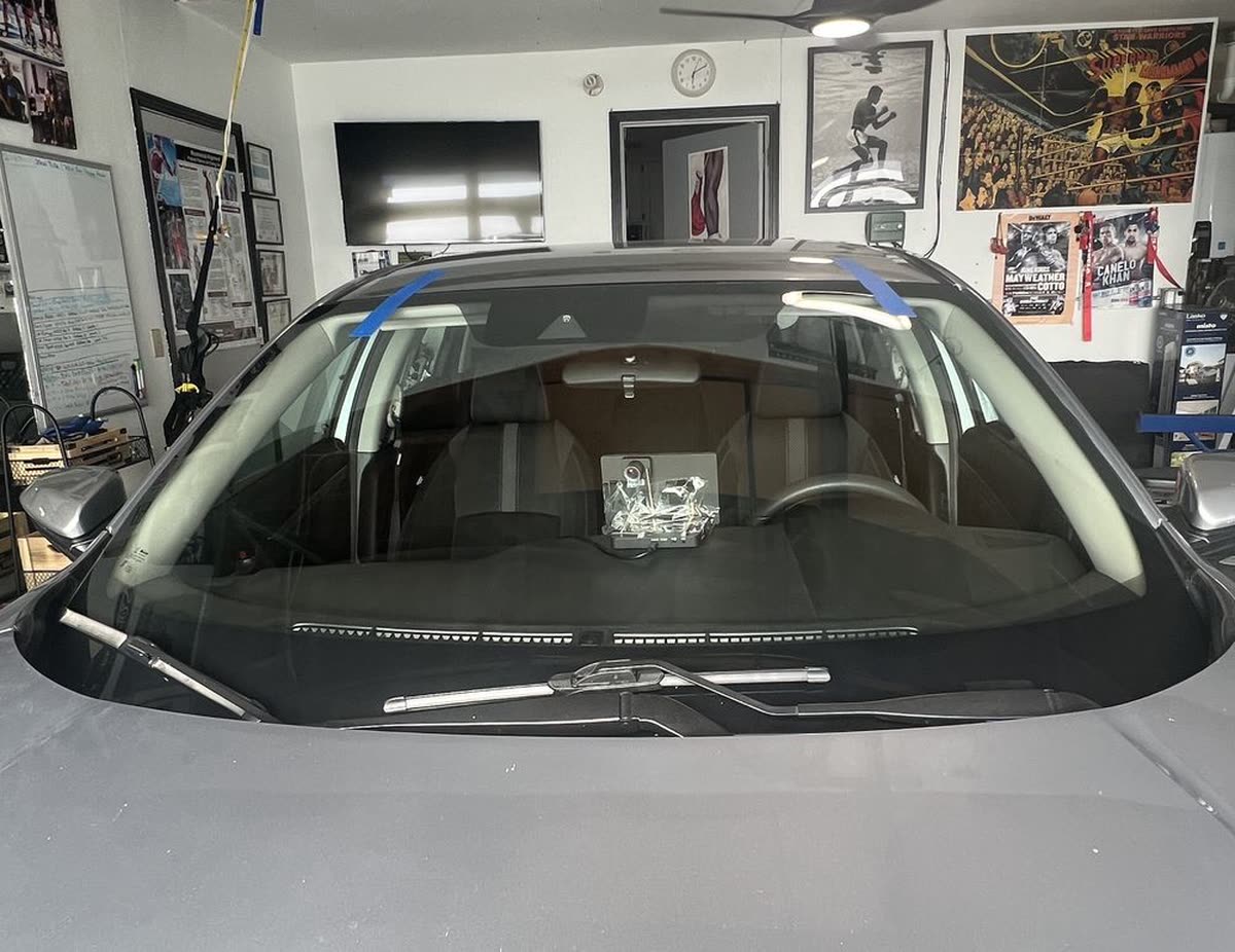 Finished windshield installation with retention tape